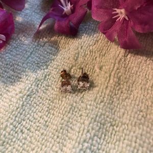 Emerald cut clear stone pierced earrings in silver